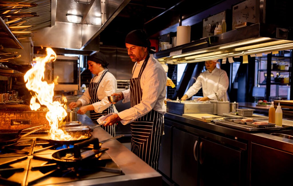 Cooks working in commercial kitchen