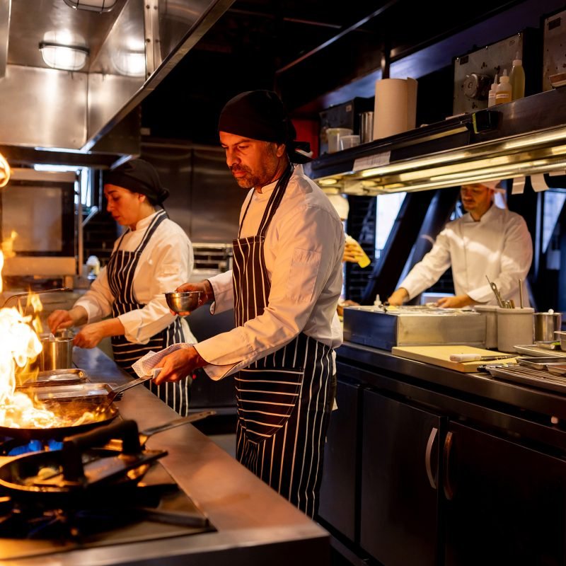 Cooks working in commercial kitchen